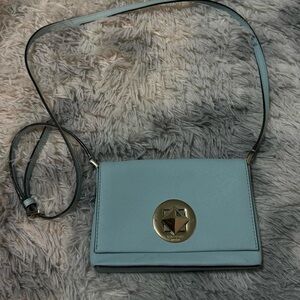 Kate Spade New York blue leather crossbody bag with gold hardware